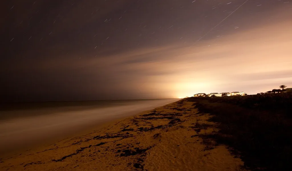 Palm Coast beach beneath a dramatic evening sky
